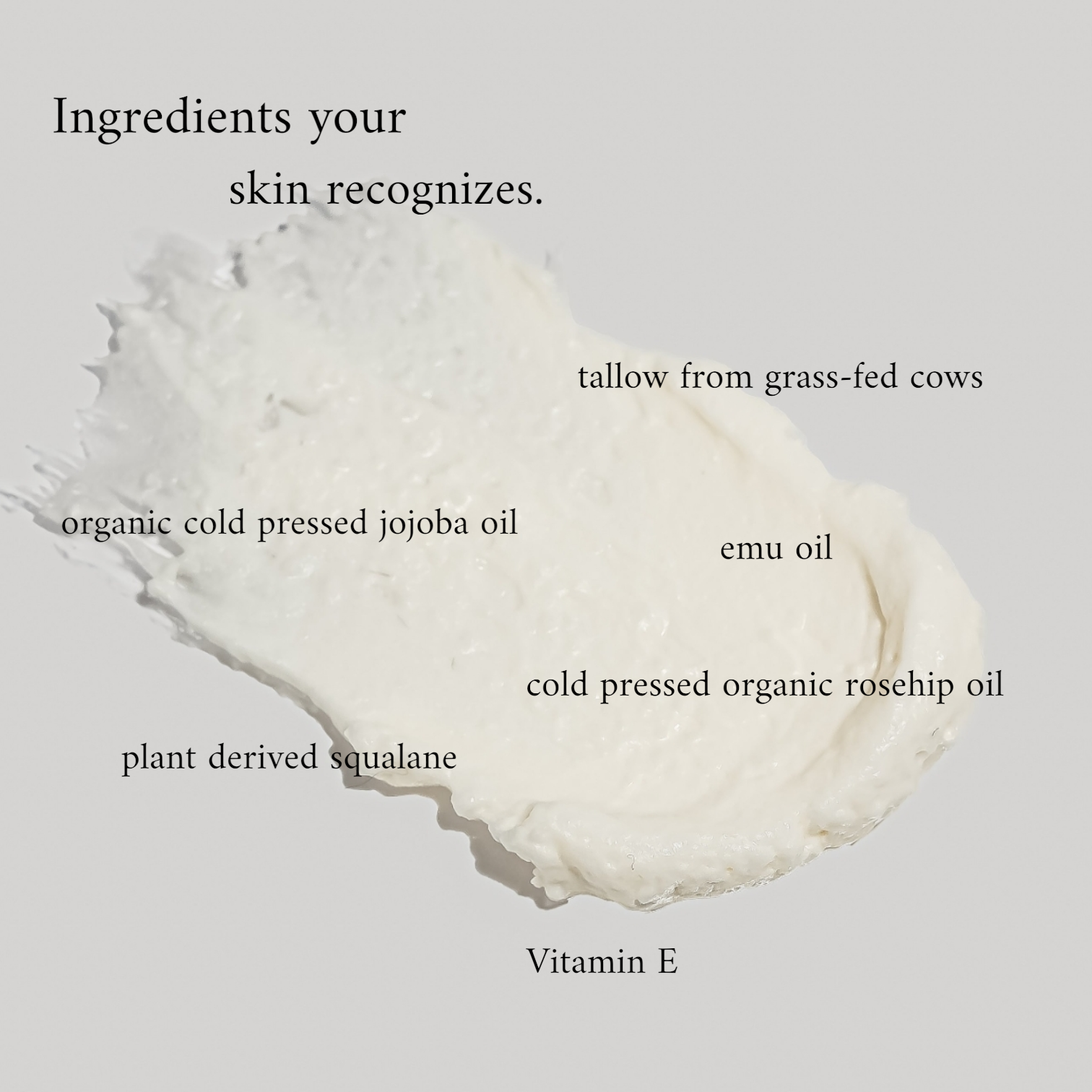 White cream with labeled ingredients on a light gray background
